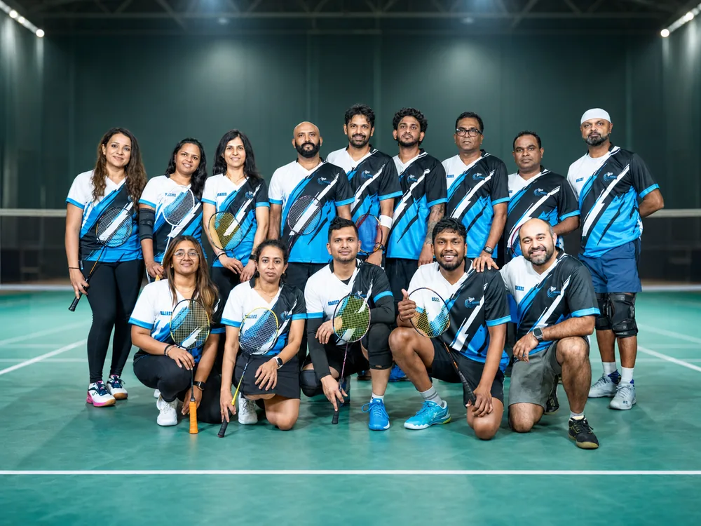 Toronto Smashers team in black and cyan jerseys gathered on court